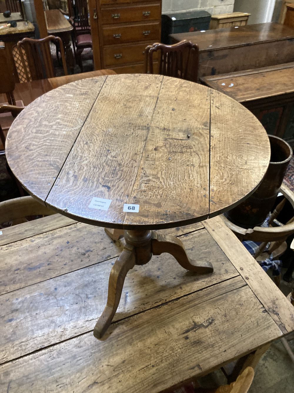 A George III oak tripod table, diameter 70cm height 67cm